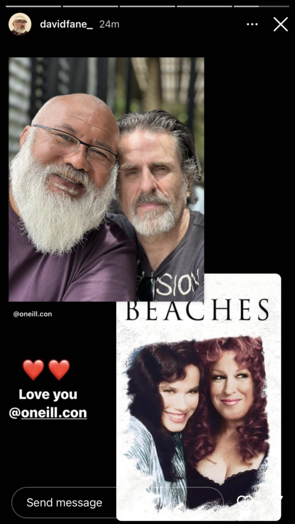 A story from David Fane's Instagram. It's the selfie that he and Con O'Neill took, with text saying "Love you @oneill.con" and the cover of a Bette Midler movie from 1988 called "Beaches".