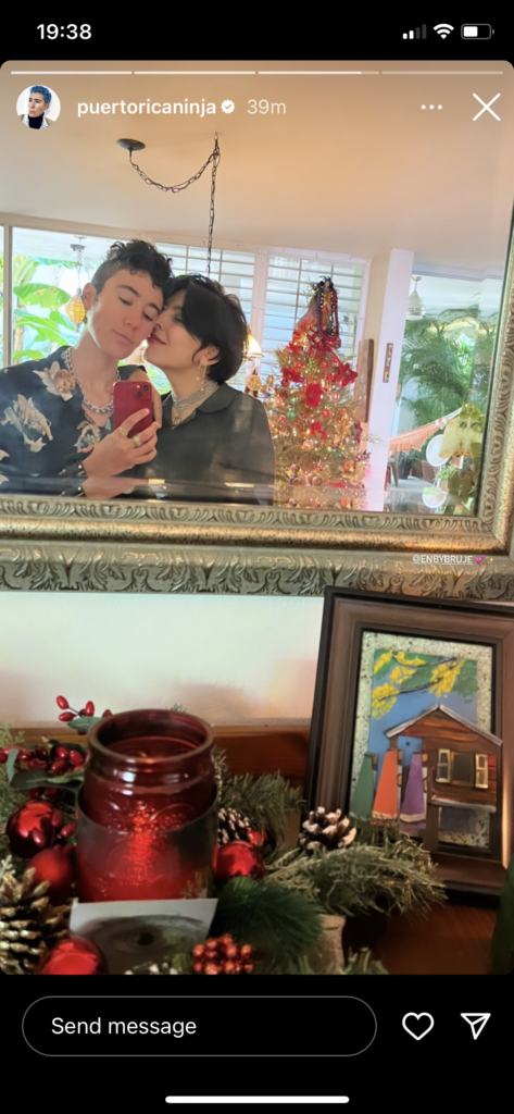 Vico and partner Ane take a sweet selfie in the mirror. Ane is almost giving Vico a kiss on their cheek.