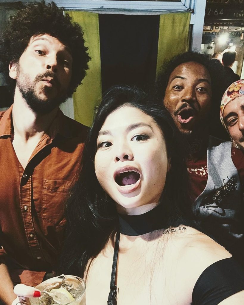 Ruibo Qian takes a silly selfie with Joel Fry, Samba Schutte, and another, unknown crew member who is wearing a bandana.