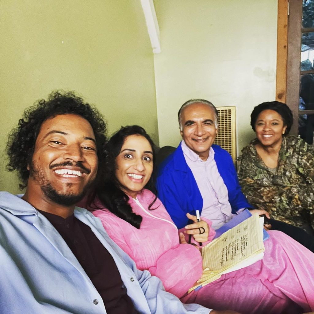 Instagram post. Samba takes a selfie with Kiran Deol, Iqbal Theba, and another, unknown Black female-presenting person. Text reads: “Back at it with this lovely bunch 🧪✨ #AdvancedChemistryFilm”