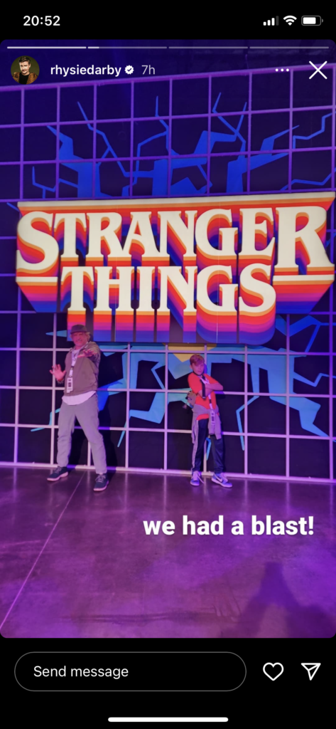 Rhys and son Theo stand in front of the "Stranger Things" logo. Text reads: "We had a blast!"
